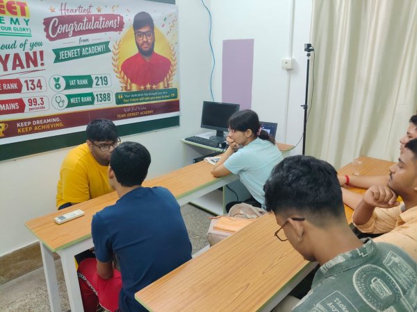 Students discussing coursework together in a JEENEET Academy classroom