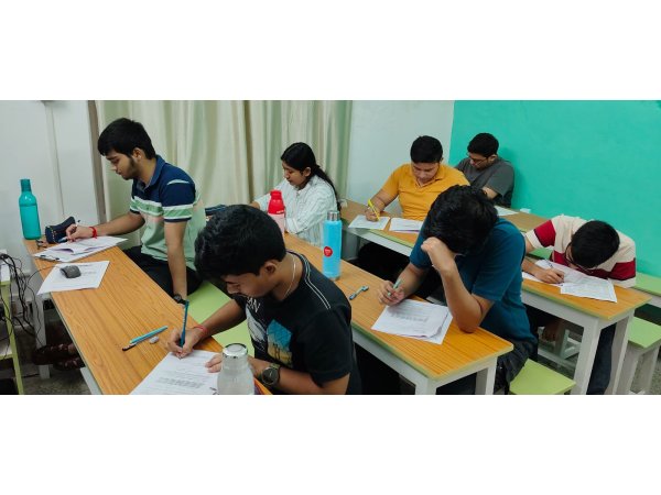 JEENEET Academy students completing written practice papers in the classroom